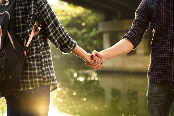 Stock image Couple in love holding hands on the green park