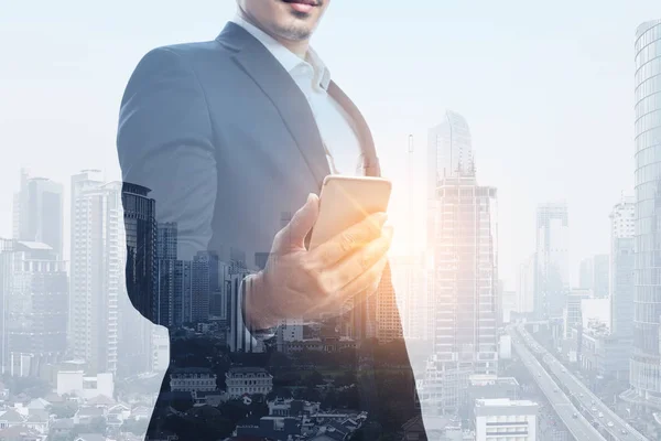 Image Businessman Holding Smart Phone City Sunlight Background Double Exposure — Stock Photo, Image