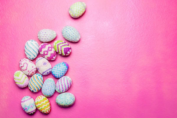 Colorful easter eggs on the pink background. Happy Easter
