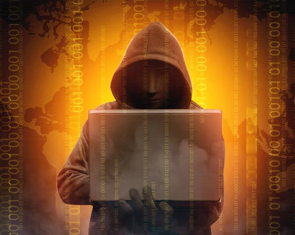 Hacker in black hoodie holding laptop with his hand and world ma — Stock Photo, Image