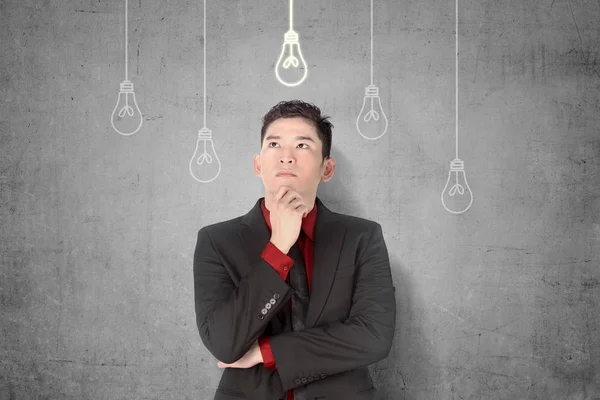 Young asian businessman thinking for new innovative idea with br — Stock Photo, Image