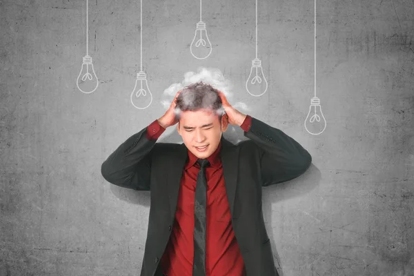 Stressed asian businessman thinking for new creative idea with l — Stock Photo, Image