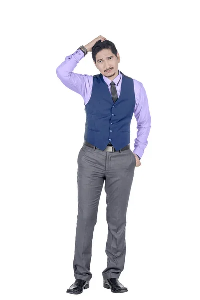 Young asian businessman scratching his head and look confused — Stock Photo, Image