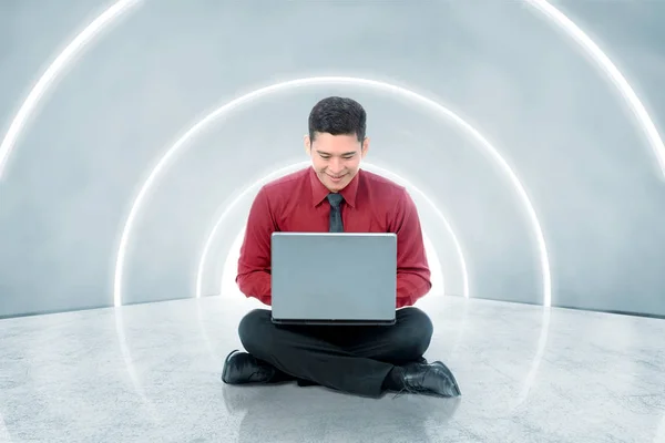 Smiling Asian Businessman Sitting Using Laptop Office Corridor Future Technology — Stock Photo, Image