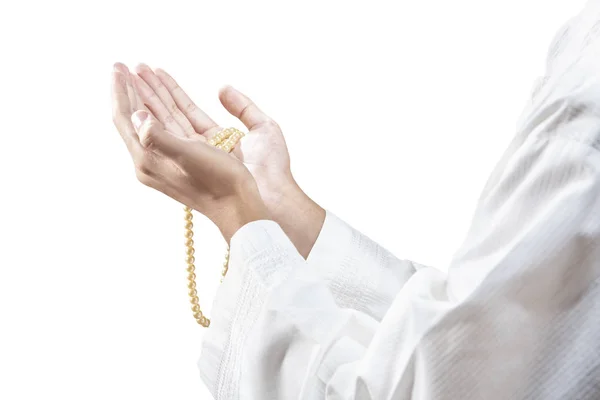 Muslim man praying with prayer beads on his hands — Stock Photo, Image