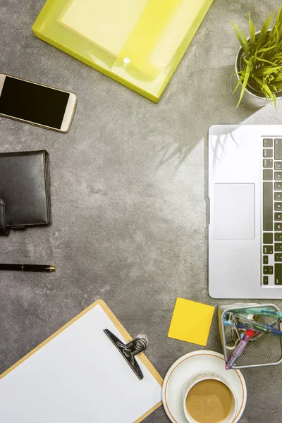 Top view of business desk with laptop, coffee, potted plant, doc — Stock Photo, Image