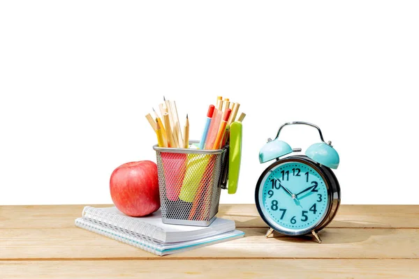 Stapel notebooks met appel en potloden in mand container wit — Stockfoto