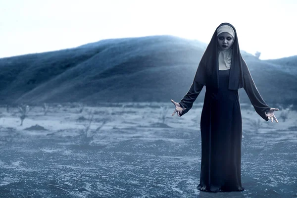 Frightening devil nun on the spooky hills — Stock Photo, Image