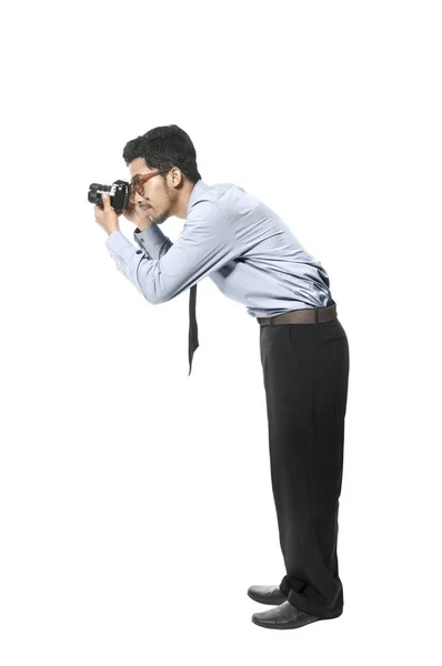 Ázsiai üzletember fog egy képet a kamerával — Stock Fotó