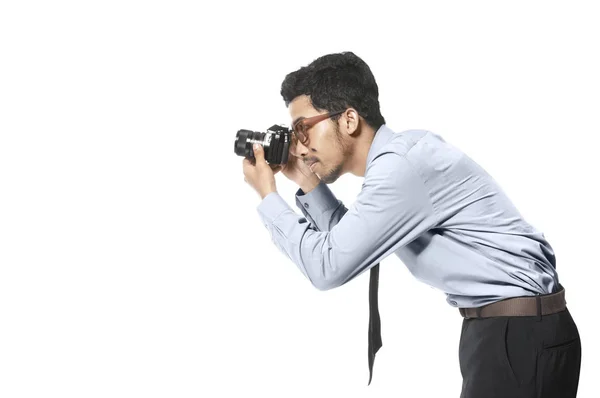 Asian businessman take a picture with his camera — Stock Photo, Image