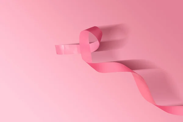 Cinta de conciencia rosa sobre un fondo de color —  Fotos de Stock