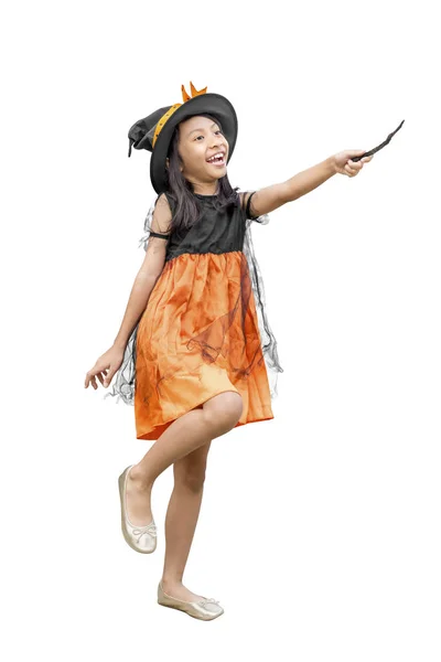 Asian girl in witch costume holding a magic wand — Stock Photo, Image