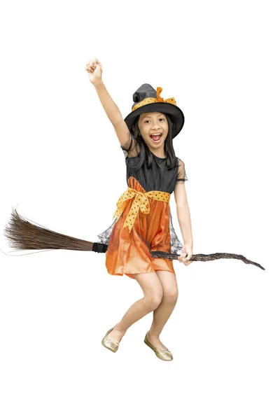 Asian witch girl flying on a magic broom — Stock Photo, Image