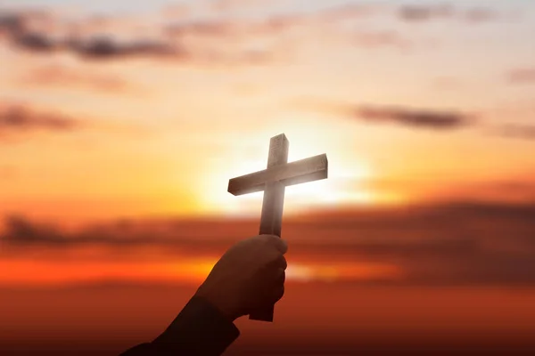 Human hand holding Christian cross — Stock Photo, Image