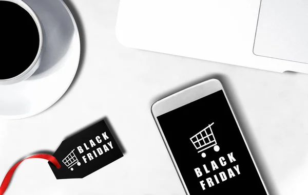 Mobile phone screen with Black Friday advert and label with Blac