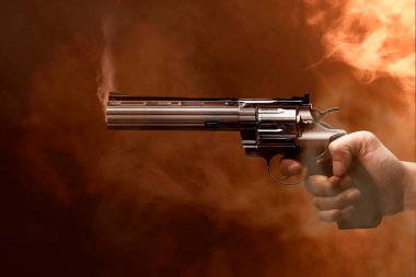 Sigara ve alev arkaplanı olan bir silah doğrultuyor.