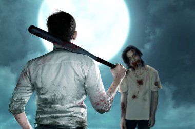 Elinde beyzbol sopası olan Asyalı bir adam dolunay geçmişi olan zombilerle yüzleşiyor.