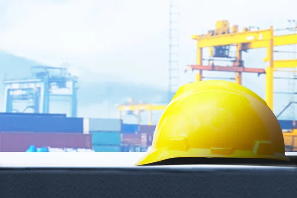 Hardhat with a seaport background. Happy Labor Day