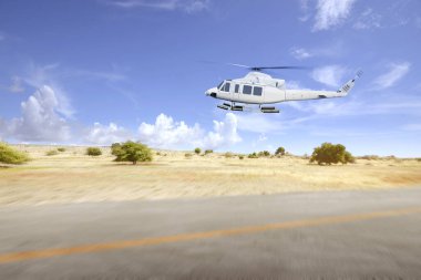 Helikopter pist manzaralı ve mavi gökyüzü arkaplanlı bir şekilde kalkıyor.