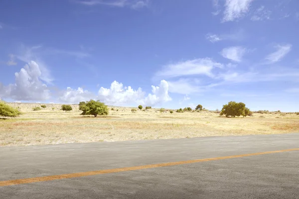 Airplane runway with landscapes views and blue sky background