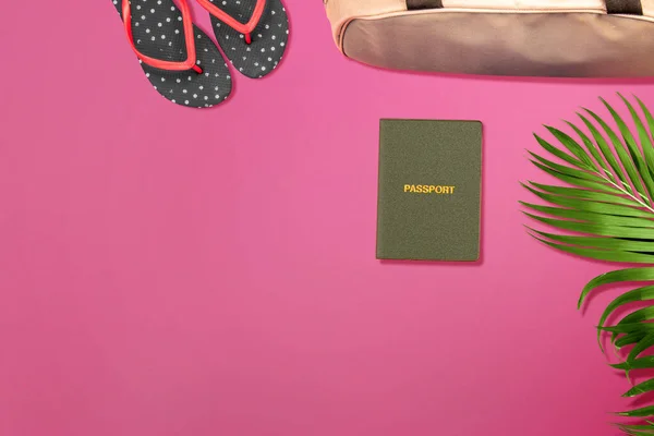 Top view of passport, slipper, and luggage bag with a colored background. World Tourism Da