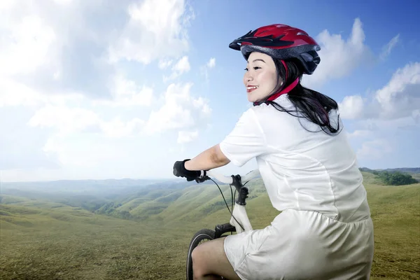 Asian Woman Bicycle Helmet Riding Bicycle Meadow Field — Stock Photo, Image