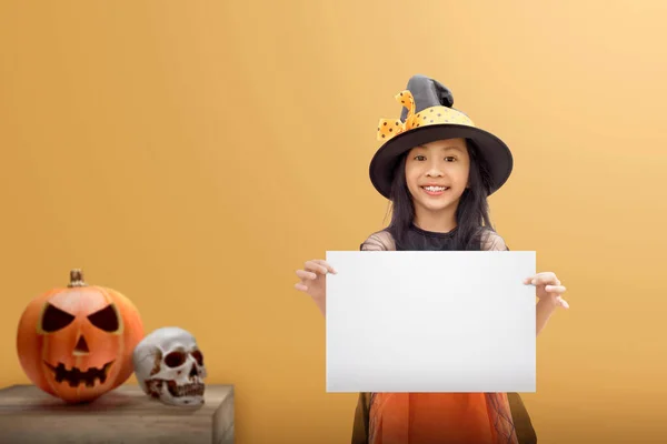 Asian Witch Little Girl Holding Empty Board Colored Background Empty — Stock Photo, Image