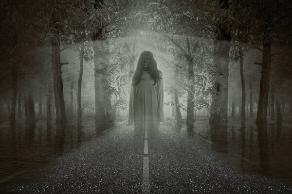 Scary ghost woman standing with night scene background. Halloween concept