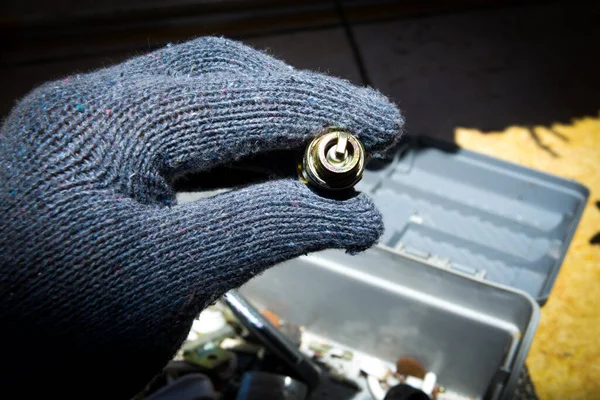 Hand Glove Holding Spark Plug Blurred Background — Stock Photo, Image