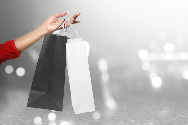 Women Carrying Shopping Bag Blurred Light Background Black Friday Concept — Stock Photo, Image