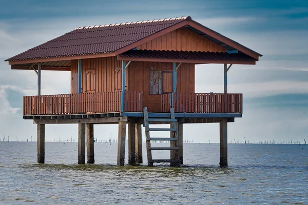 Traditional Thai fisherman houses made of wood in the middle of