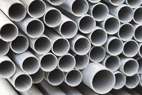 Metal profile pipe of round section in packs at the warehouse of metal products — Stock Photo, Image