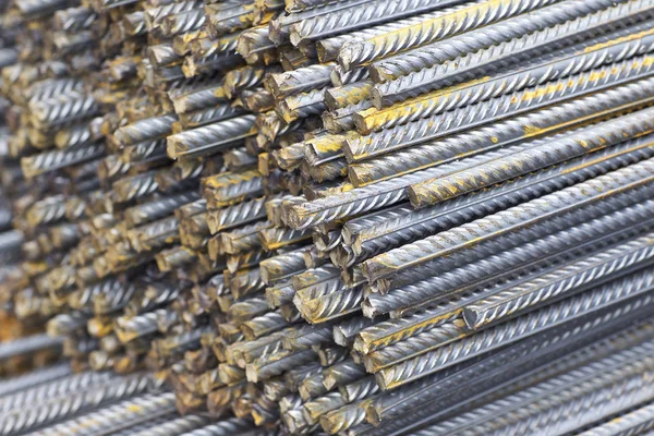 Reinforcing bars with a periodic profile in the packs are stored in the metal products warehouse — Stock Photo, Image