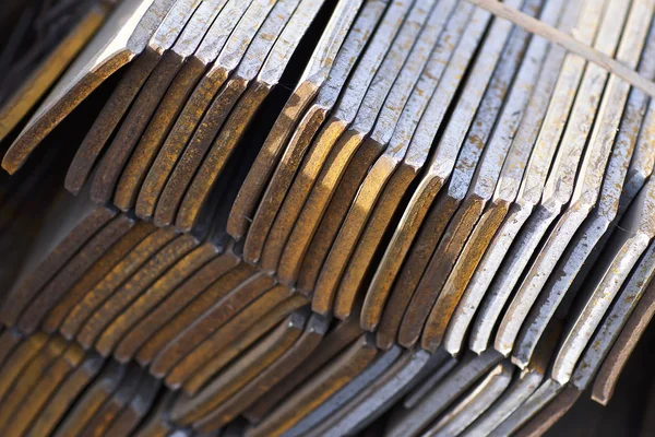 Metal profile strip in packs at the warehouse of metal products
