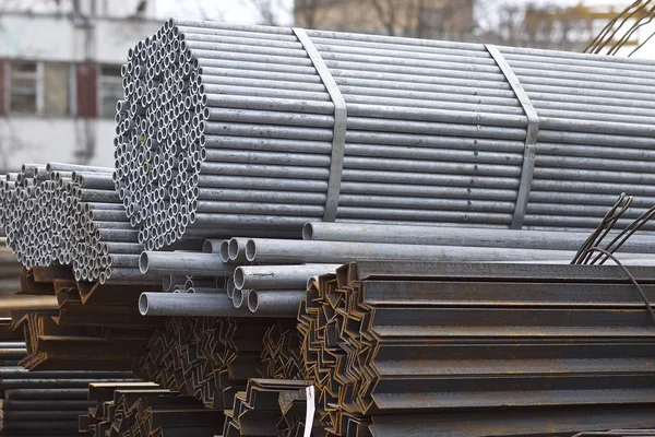 Metal profiles of different kinds are located in the metal products warehouse — Stock Photo, Image