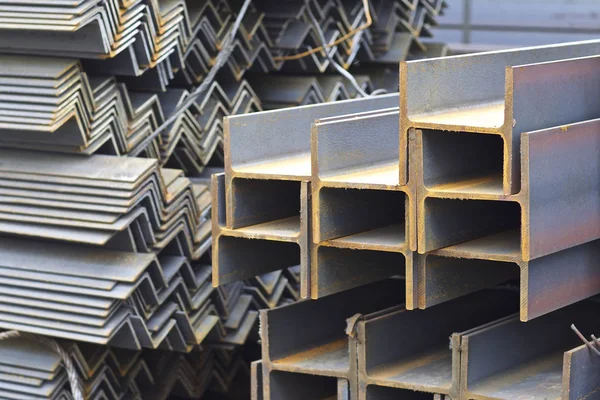 Metal profiles of different kinds are located in the metal products warehouse — Stock Photo, Image