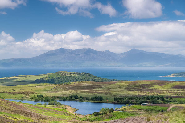 The magnificent Isle of Arran looking through a June heat haze that is sitting on top of the water