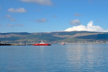Two car ferries at McInroy's Point Gourcock running between Gourock and Dunoon on a bright Octobers day in Scotland. clipart