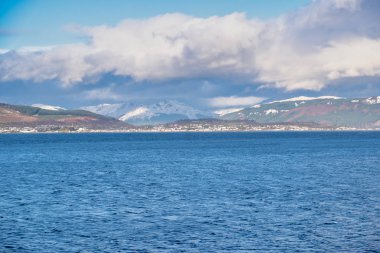 Dunoon and the Argyle Hills looking over the Holy Loch from Gourock with the first signs of Snow on the hills in December clipart