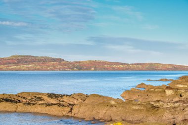 Little Cumbrae from Portencross rocky shore line. clipart