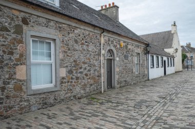 Irvine, Scotland, UK - July 12, 2020: Heckling Shop in Glasgow Vennel. While working in Irvine Burns lodged at Number 4 Glasgow Vennel, which is commemorated by a plaque. clipart