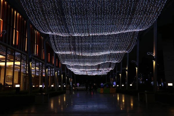 above a walkwak in the city are decorated with led lighting line in festival