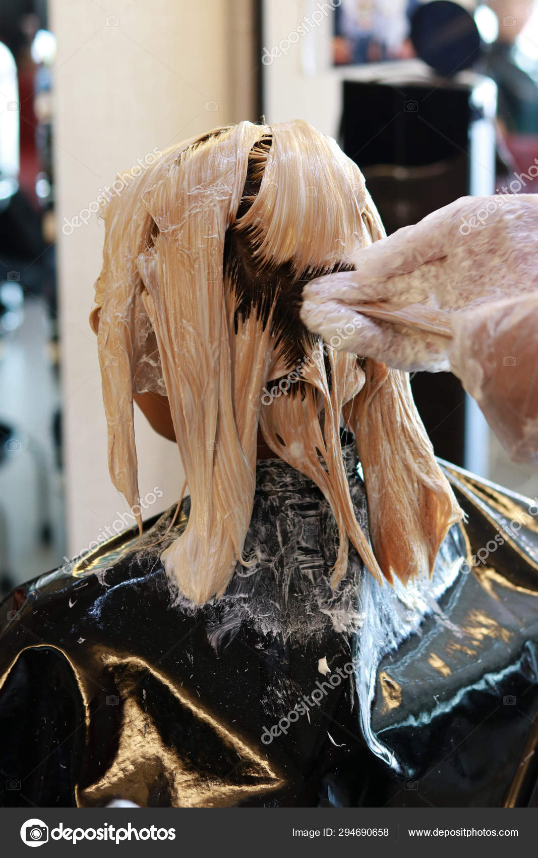 Hair Bleaching In Back View Portrait Stock Photo