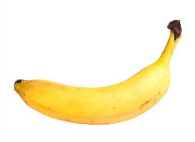 Beyaz arka planda kahverengi lekeli olgun sarı bir muz.