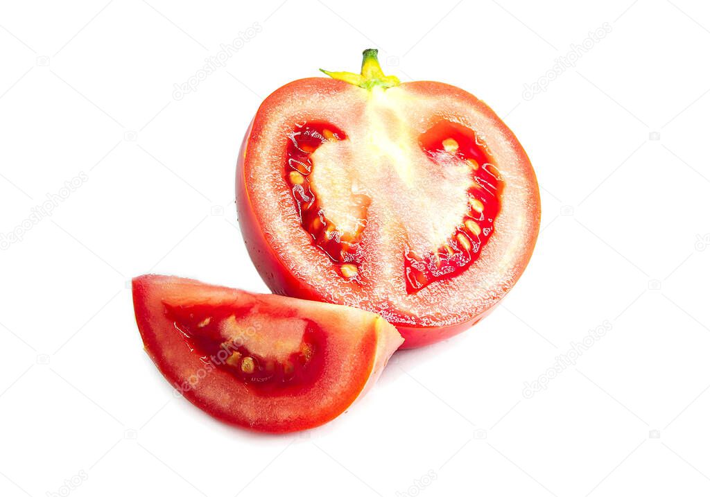 Ripe bright cut red tomato with green tail isolated on white background