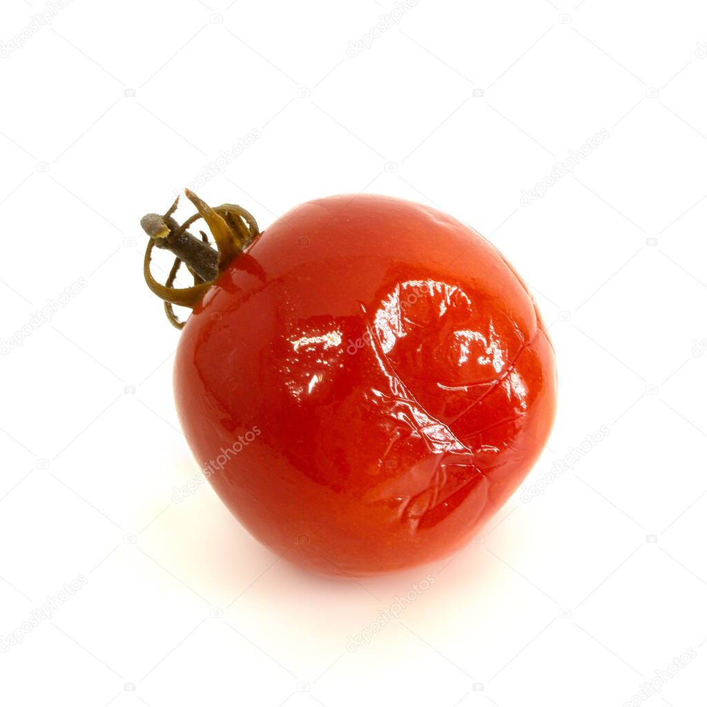 One bright red salted tomato with tail isolated on white background