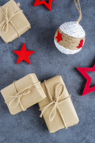 christmas presents in decorative boxes on a dark background