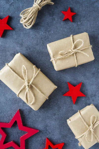 christmas presents in decorative boxes on a dark background