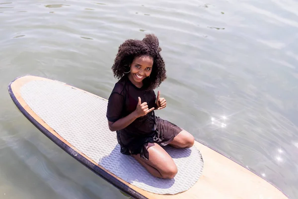 Young Afro Girl Sitting Paddle Board Sea — Stock Photo, Image