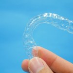 Hand holding clear plastic retainer teeth Stock Photo by ©Bhubeth ...
